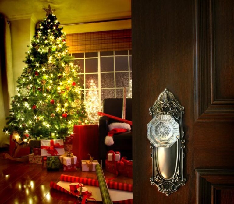 Door opening to Christmas tree with gifts
